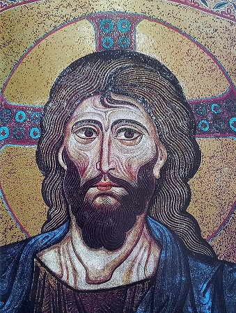 An image of a mosaic artwork of Christ, who is depicted with a halo