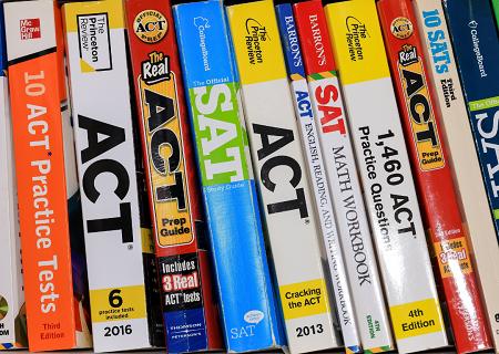 SAT and ACT&reg; test study books on a bookshelf