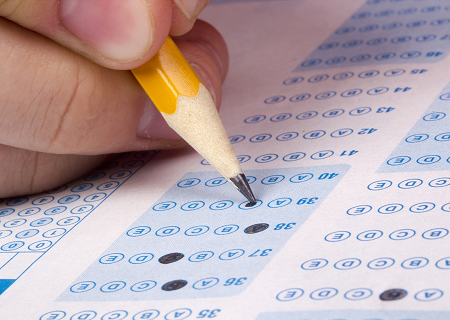 Student filling out a scantron