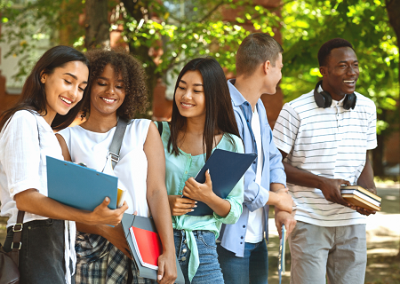 5 college students chatting on campus